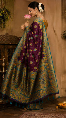 Purple silk saree with woven floral motifs and contrast teal blouse